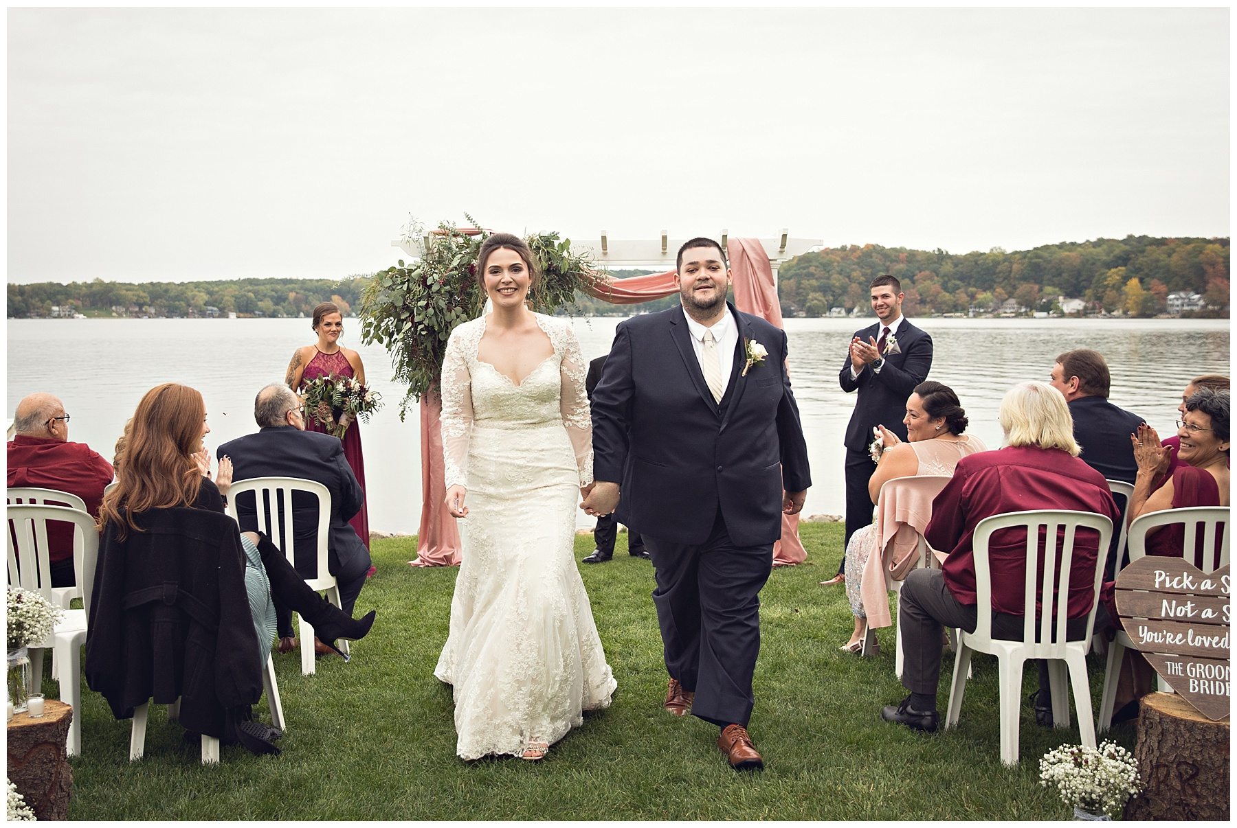 Just married couple at Bay Pointe Inn on Gun Lake photographed by Melissa Gregersen Photography
