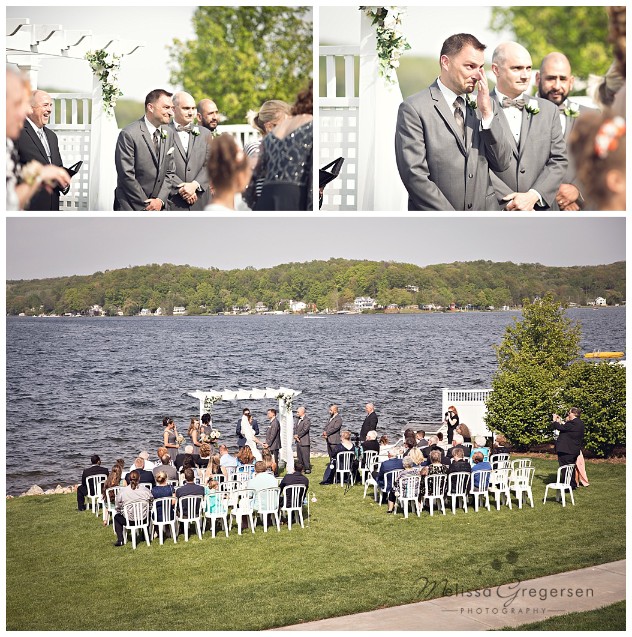Groom's reaction to seeing his bride for the first time walking down the aisle at Bay Pointe Inn on Gun Lake photographed by Melissa Gregersen Photography