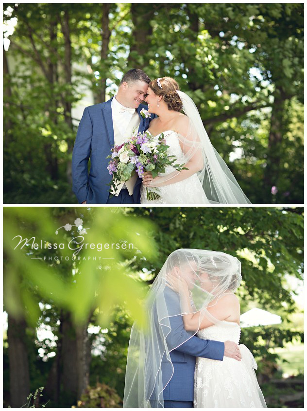 Bride and groom under the trees at the vintage rose barn 