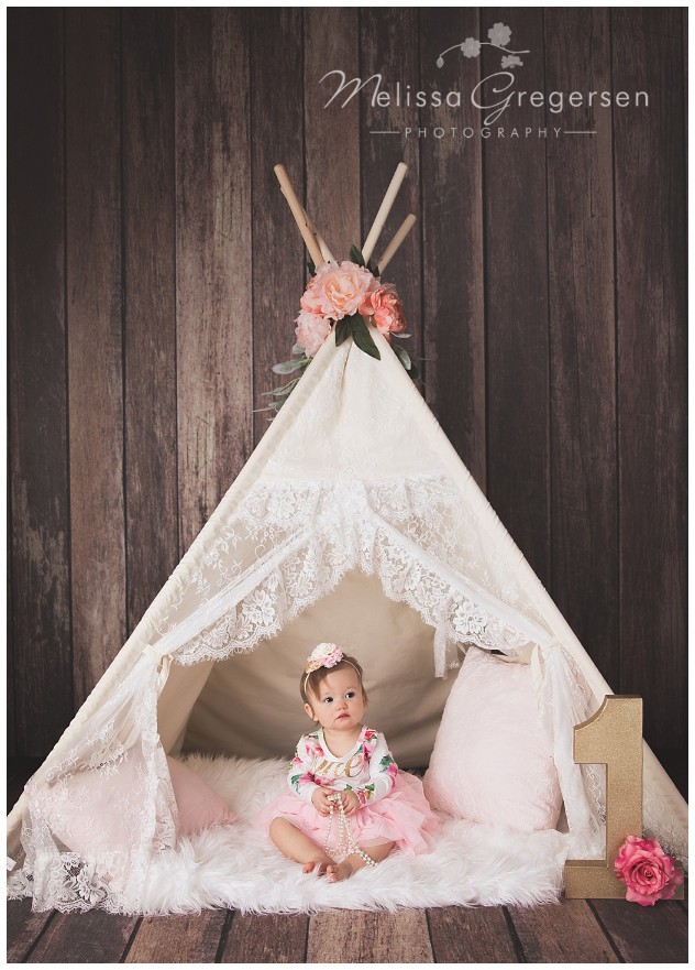 One year old baby girl with lace teepee for photography session at Gregersen Photography Studio