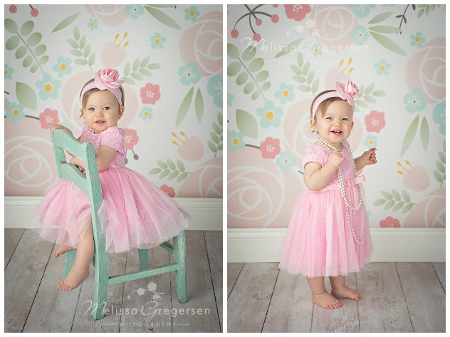 One year old baby girl dressed in pink dress and pearls for one year old photography session at Gregersen Photography