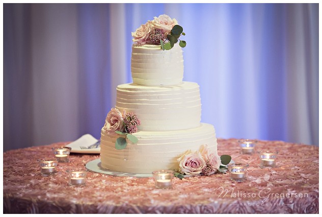Wedding cake was the perfection of simplicity.
