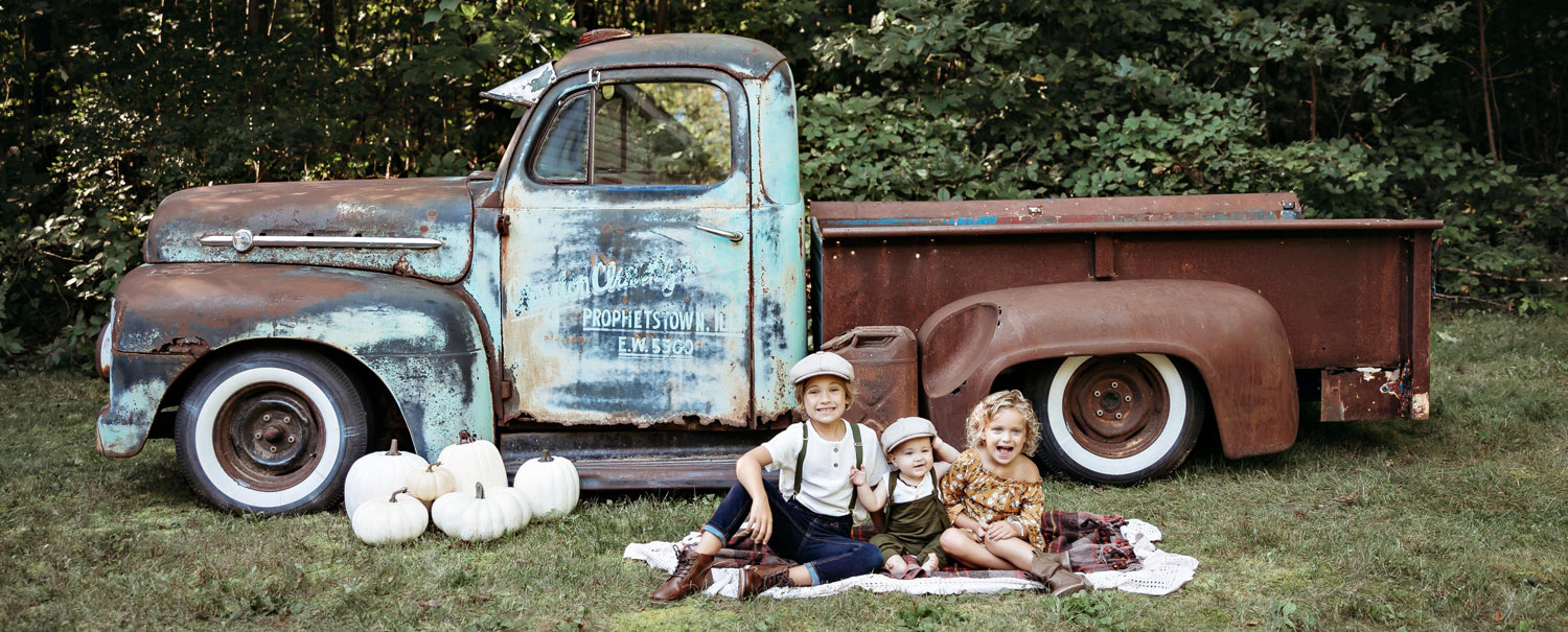 kids by vintage truck